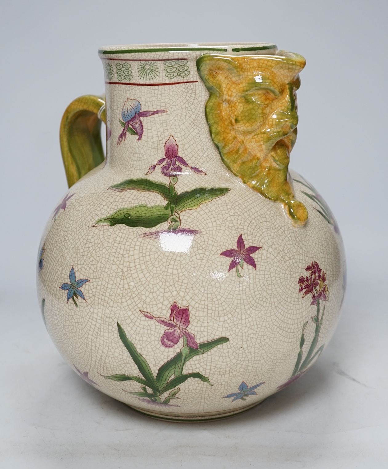 From the Studio of Fred Cuming. A large crackle glaze pottery mask jug, 29cm high. Condition - good